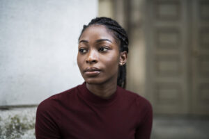 Young woman wondering if her unplanned pregnancy will ruin her plans in life.